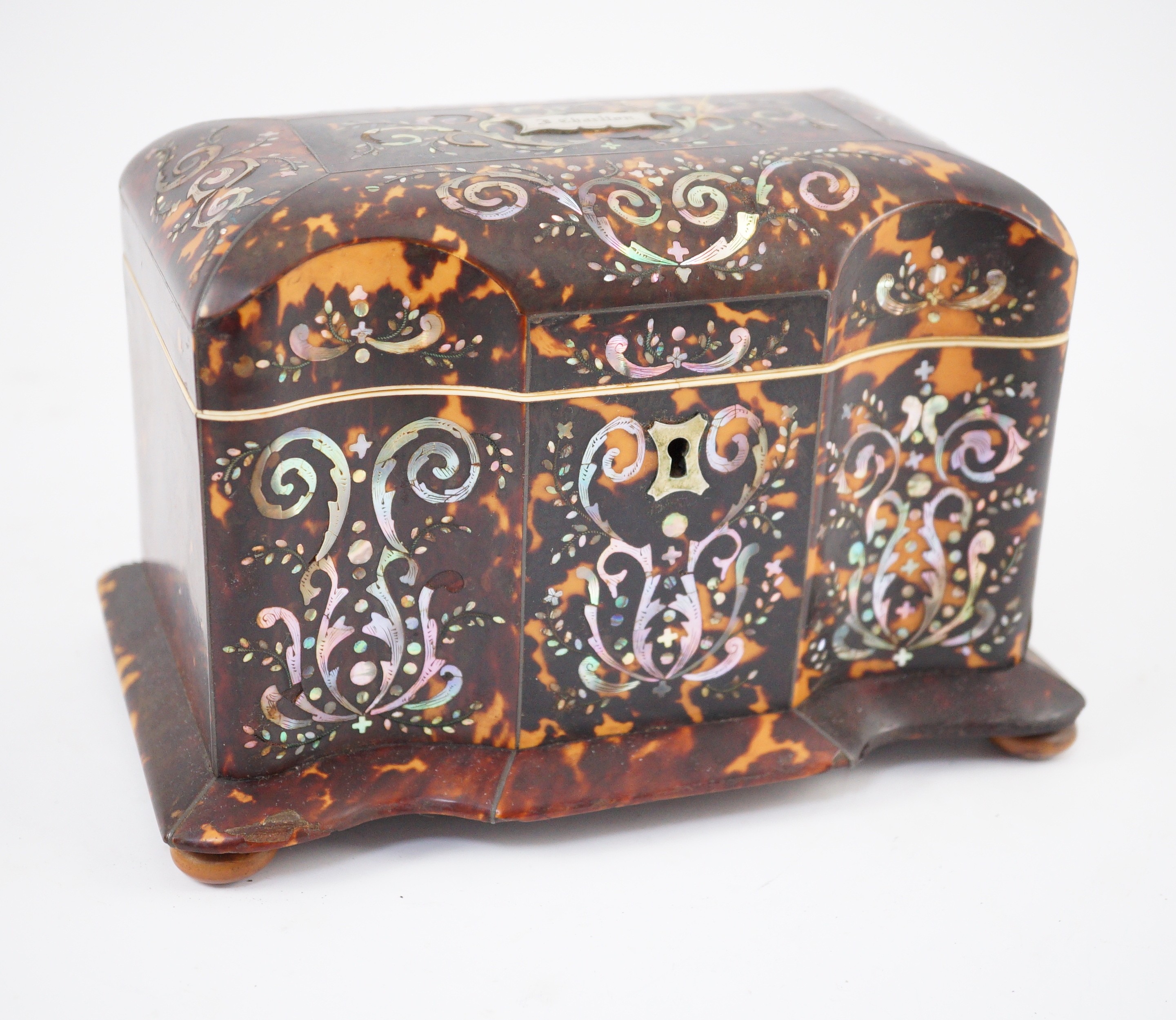 A Regency mother of pearl inset blond tortoiseshell tea caddy, 20cm wide 12.5cm deep 13.5cm high